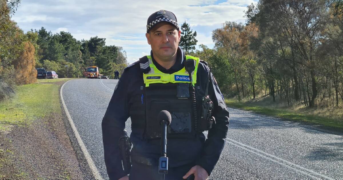 Ballarat Highway Patrol Sergeant David Whitwell adressing the media at the scene of Thursday's fatal crash in Rokewood. Picture: Gabrielle Hodson.