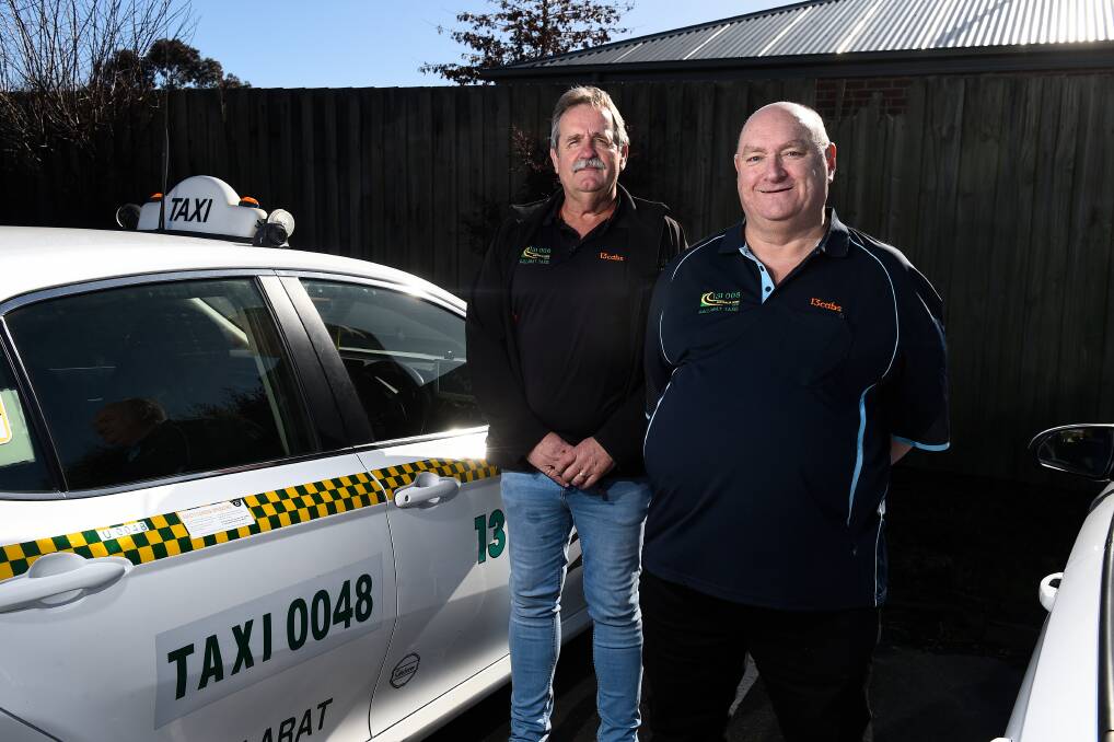 TRAINING: Ballarat Taxis chief executive Stephen Armstrong (left) with former homeless man Brad Hannaford who is training to become a taxi driver. Picture: Adam Trafford.