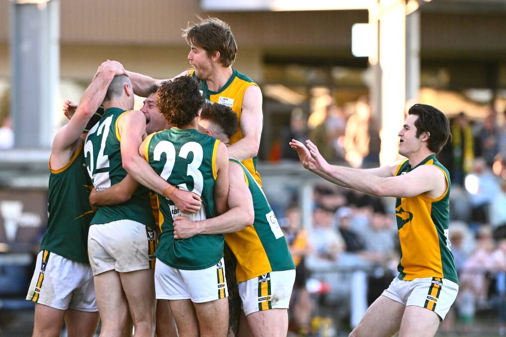 Harry Biggs of Gordon (second from left) celebrates with teammates Ethan Crackel ( top) and (L-R) Billy Griffiths, Rohan Clampit, Ben Frazer, Jordan Clampit and Matthew Hoy in the Eagles' 2023 CHFL grand final premiership win. Picture by Adam Trafford