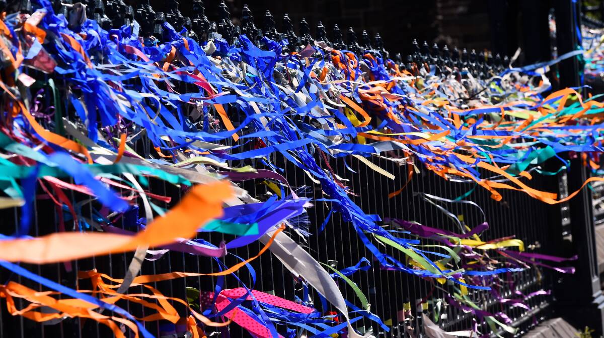 Recognition and remembrance: Loud Fence ribbons on fence of St. Patricks Cathedral, Sturt Street. Photo: Adam Trafford 