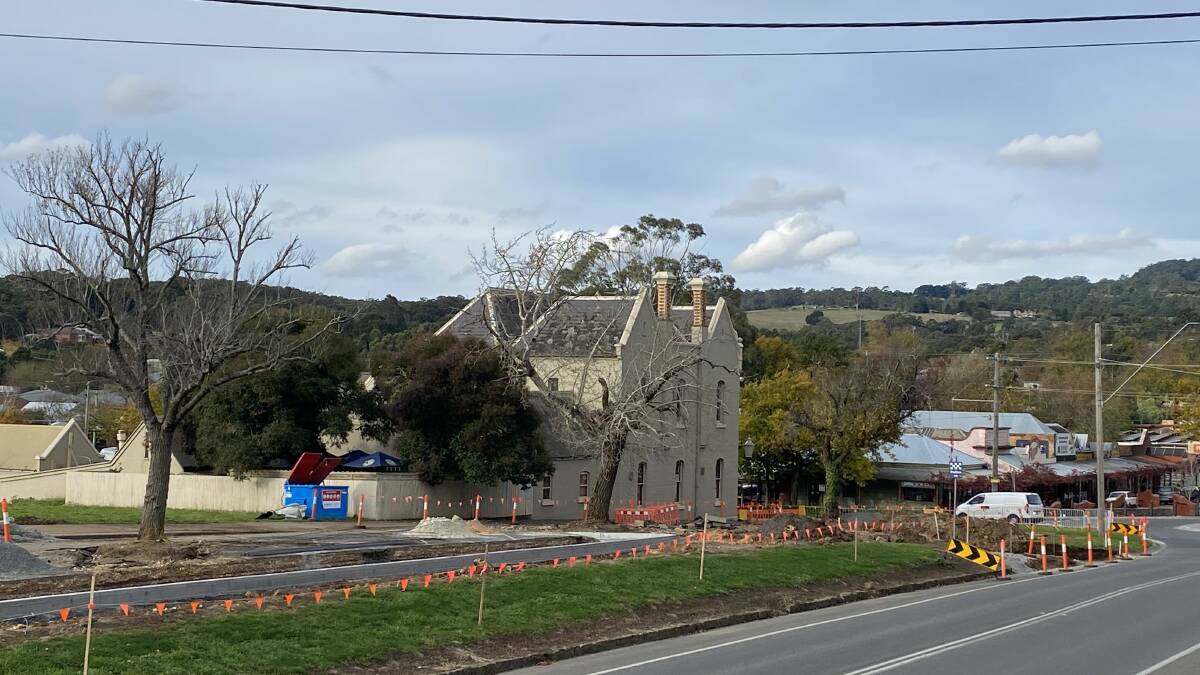 Photo depicting close trenching around three of the five heritage protected trees on Learmonth Street on 25 May 2022