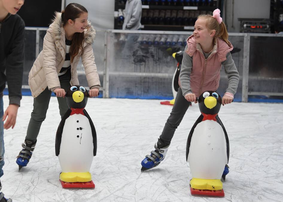 Isabel Conduit and Cleo Maya enjoying the Winter Festival's ice-skating rink in 2019. Photo: Kate Healy