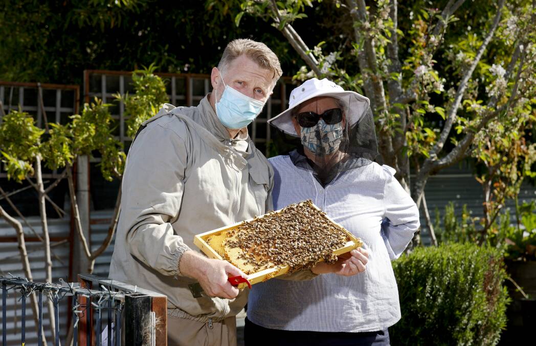 Beekeepers Scott Denno and Amanda Collins. Photo: Luke Hemer