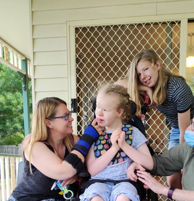 (L-R) Rebecca Paton with her daughters Sarah and Hannah. Sarah lives with profound intellectual and physical disabilities. Photo: supplied