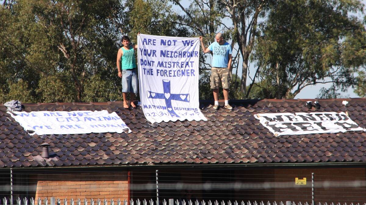 Asylum seekers protesting on the roof of Villawood detention centre in 2011. Photo: Adam J.W.C