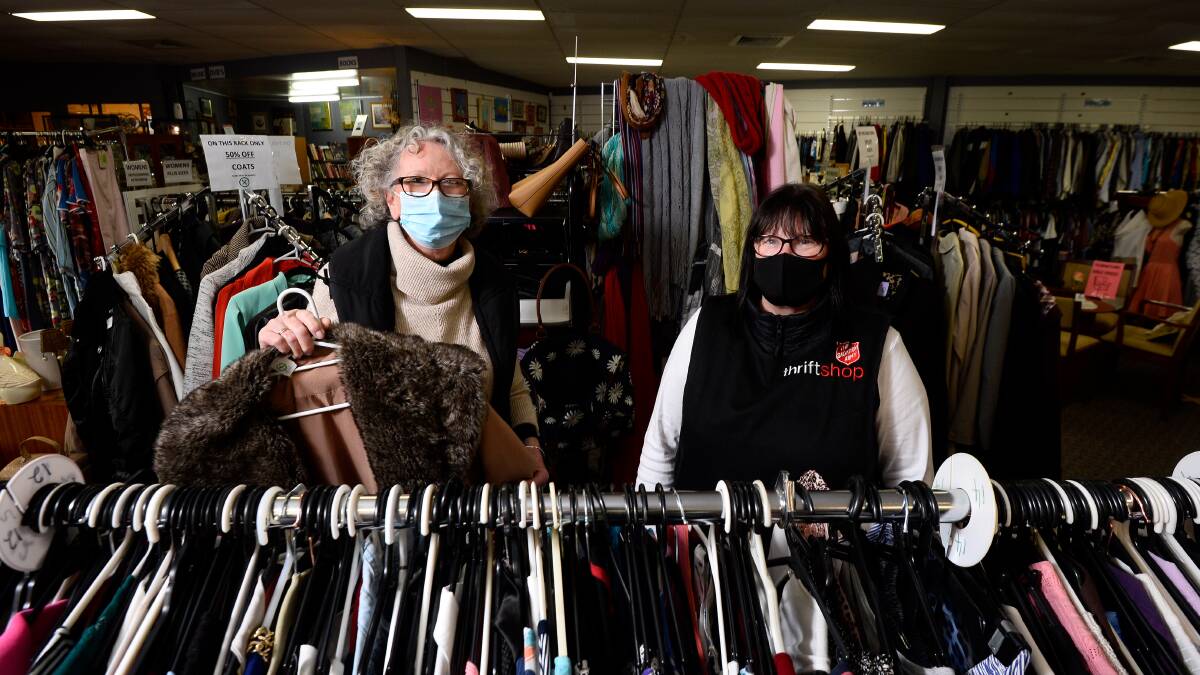SHORTAGE: Volunteers Marie Lyons (left) and Diane Lindsay at Salvation Army's Creswick Road thrift shop when it reopened in 2020. Picture: Adam Trafford