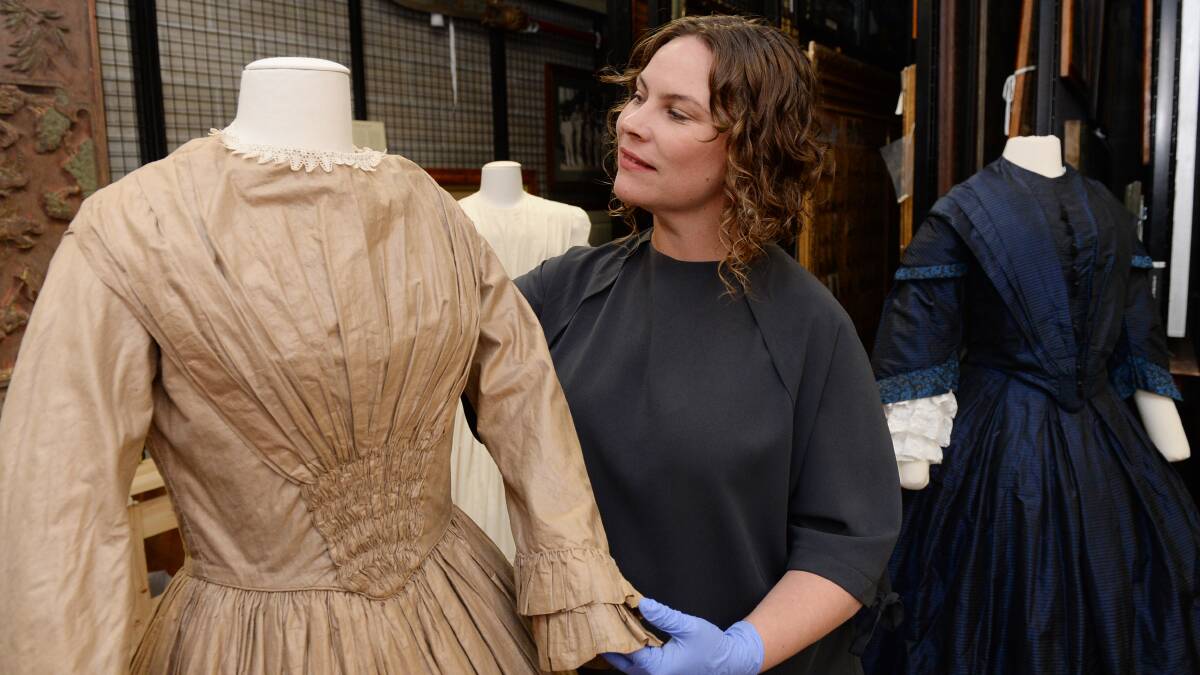 Rare Trades Centre general manager Erin Santamaria with an original 1860s service dress, looking to the past to 'find answers for a better fashion future'. Picture by Kate Healy. 