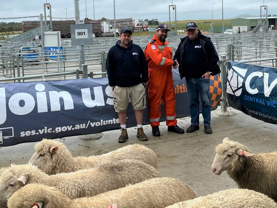 CVLX assistant manager Lucas Fudge, Ballarat SES controller Gordon Hicks and CVLX manager Jeff Paull in one of the pens sold off for auction to raise funds for Ballarat SES. Picture supplied.