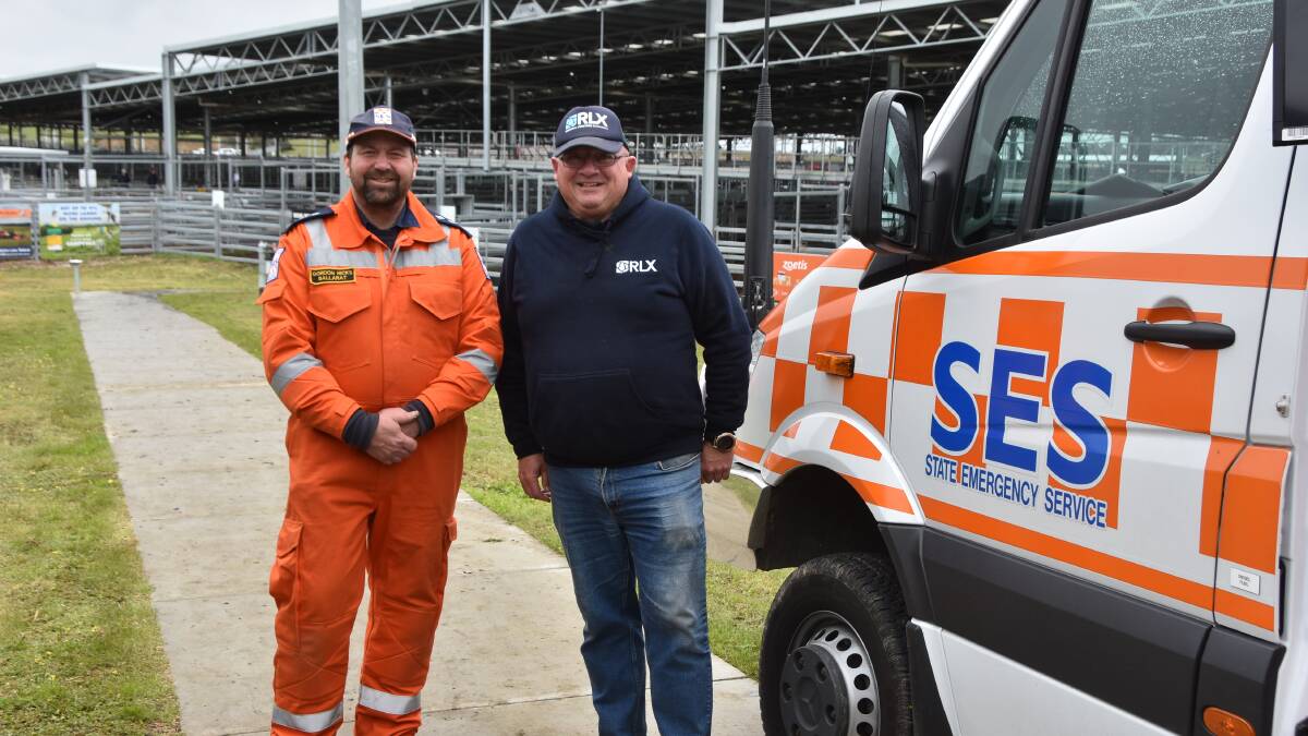 Ballarat SES controller Gordon Hicks and CVLX manager Jeff Paull. $6750 was raised via an auction and sausage sizzle at the saleyards this past Tuesday. Picture by Philippe Perez.