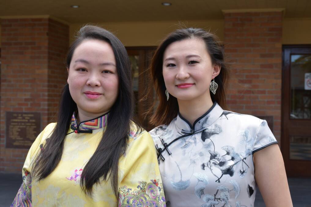 Intercultural ambassador and Chinese Australian Cultural Society secretary Yilin Liu with committee member April Sui. Picture by Nieve Walton