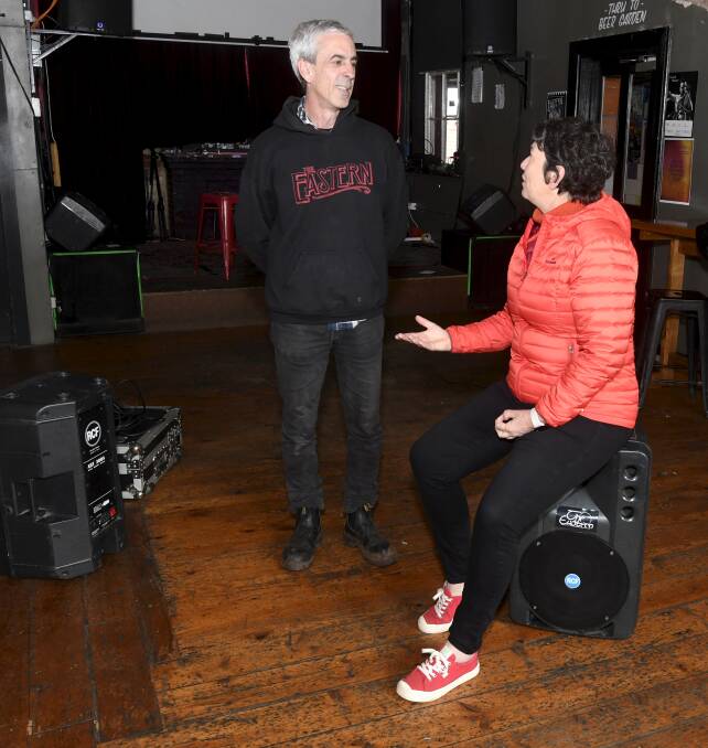 Matt Stone, Eastern Hotel owner with Eureka incumbent Michaela Settle discussing promises to suport the live music industry in the regions. Picture by Lachlan Bence