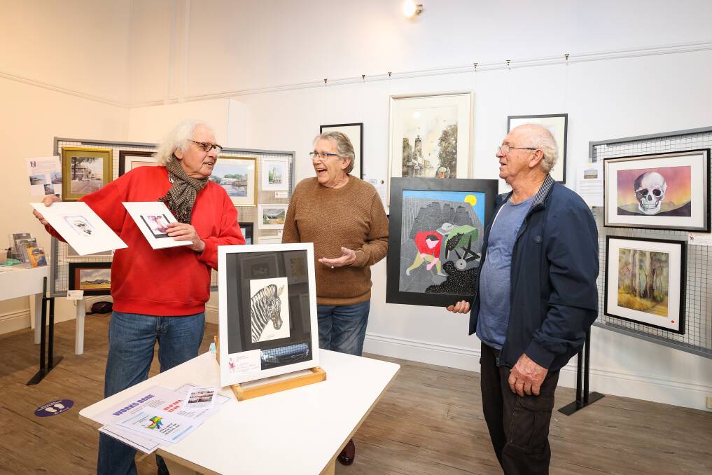 CREATIVE: The Colourful Bunch are currently exhibiting at the Art Space, pictured members Kirk Waldorf, David Adams and John Canham. Picture: Luke Hemer