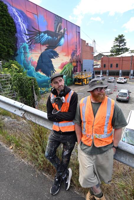 Field Street mural, lead artist Chuck Mayfield and assistant artist Cax One. Picture by Lachlan Bence