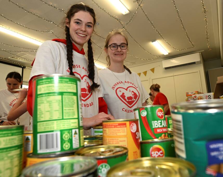 Reverse Advent Calendar volunteers Naomi Shaw and Sarah Linahan. Picture by Lachlan Bence