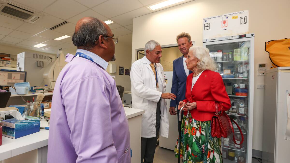 RESEARCH: Professor George Kannourakis talks to Sam Newman and Lady Primrose Potter during a tour of the Fiona Elsey Cancer Research Institute. Photo: Luke Hemer