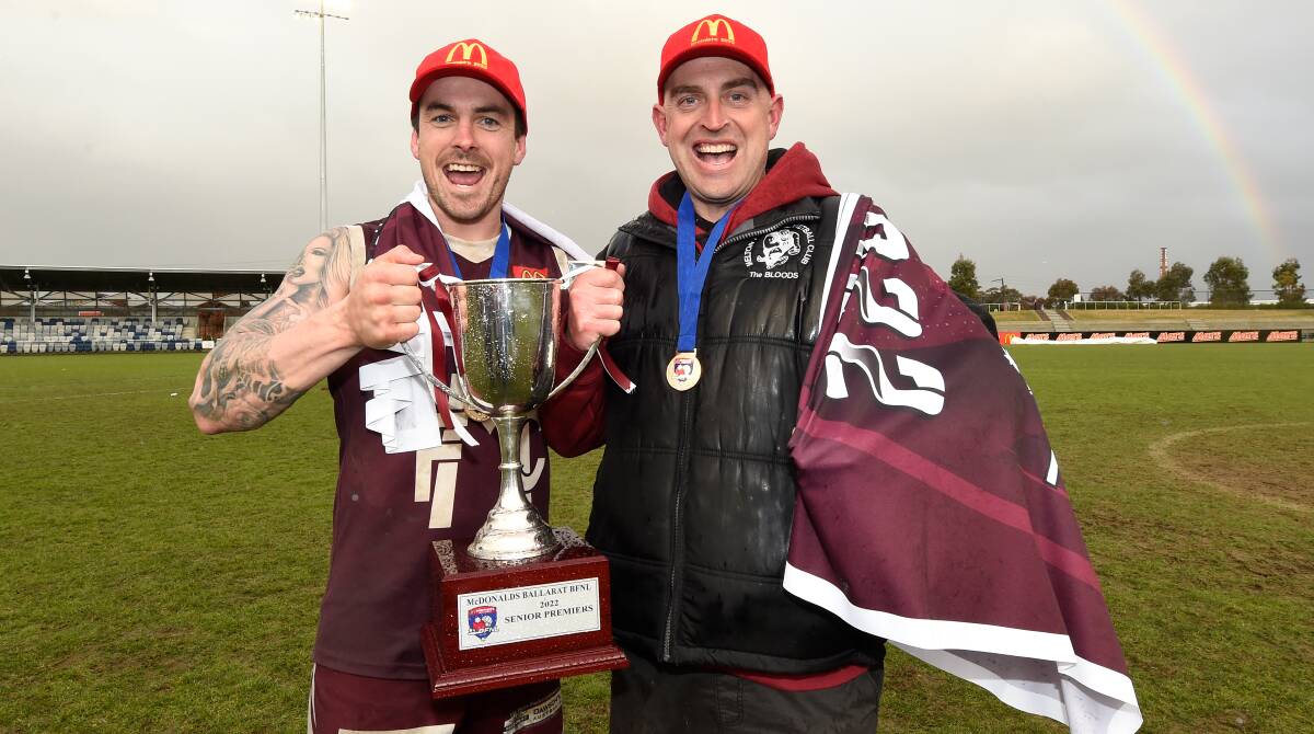 Melton coach Aaron Tymms (right) and captain Braeden Kight celebrate the 2022 BFNL premiership. Picture by Adam Trafford