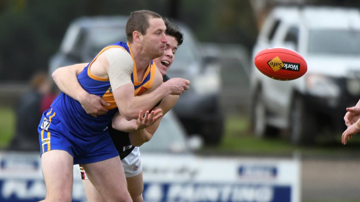 Sebastopol's Lachie Cassidy fires a handball against Bacchus Marsh. Picture by Lachlan Bence