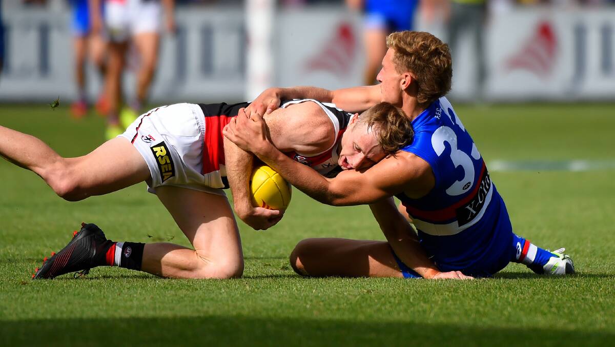 Aaron Naughton tackles Nick Hind at Mars Stadium. Picture by Adam Trafford