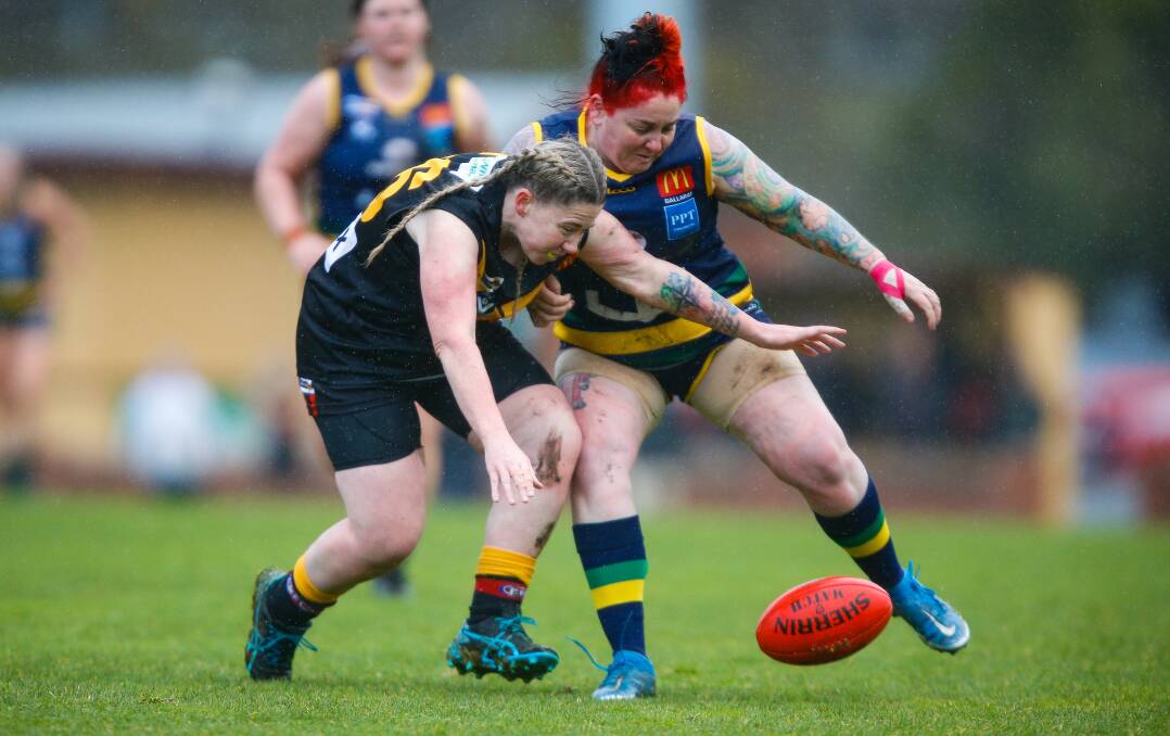 Katie Fairall of Bacchus Marsh and Lake Wendouree's Simone McNeight fight for the loose ball. Pictures: Luke Hemer.