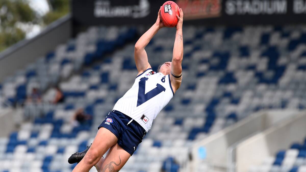 Scott flies back for a mark in the AFLW Under-18 Championships.