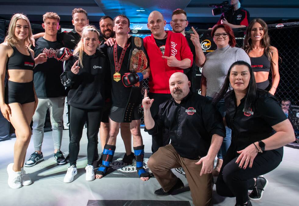 Michael Alsop with his Infinite MMA support team after his triumph.