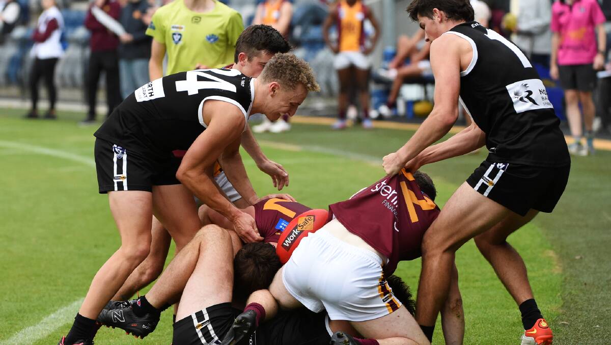 North Ballarat and Redan players scrap in Saturday's round two BFNL match. Picture by Lachlan Bence