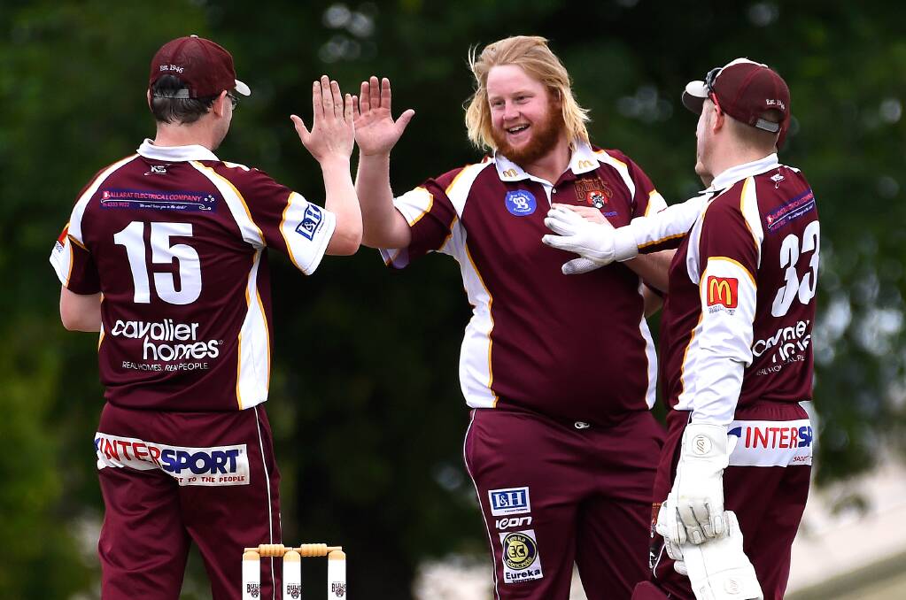 Reece Wynd of Brown Hill CC (middle) celebrates a wicket with teammates. Picture by Adam Trafford
