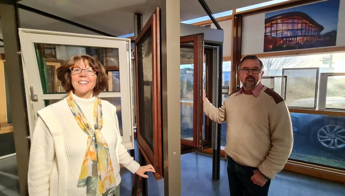 Edith and Tony Paarhammer in the Ballan showroom, showing off a specialist double-glazed window made of super-dense and heavy hardwood which is resistant to bushfires. Picture by Gabrielle Hodson.