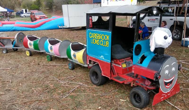 BRINGING JOY: Ian Hoyland's miniature train was created from a ride-on mower and travelled the state, including this 2019 Keeley's Cause event in Ballan. Picture: Facebook. 