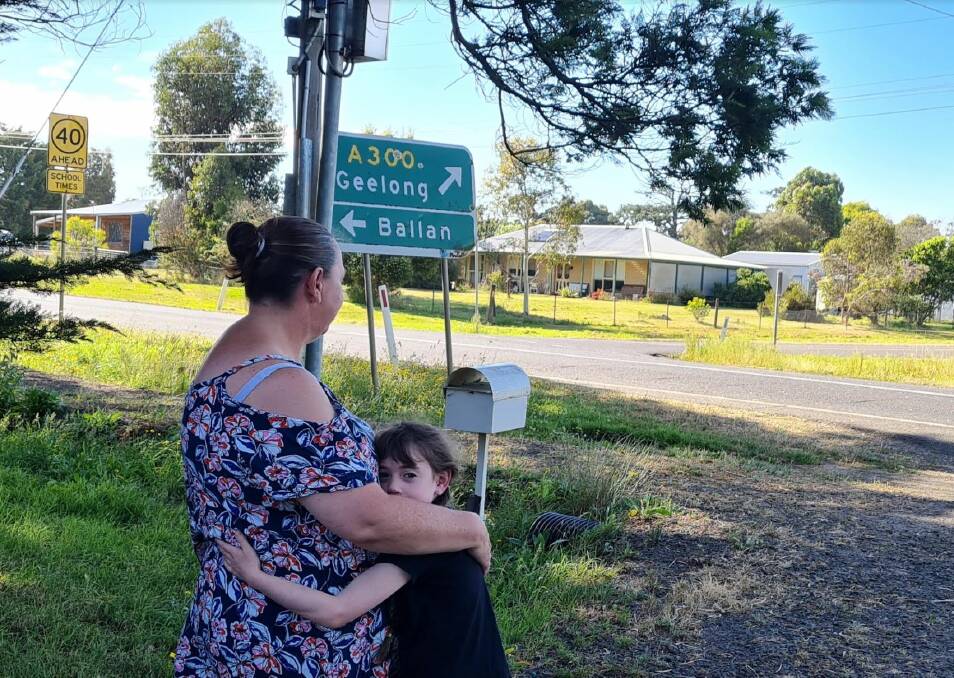 Leeanne Lubcke and her daughter look out on their driveway on the Midland Highway (Sutherland Street) which she wants reduced to 50 km/h. Picture by Gabrielle Hodson.