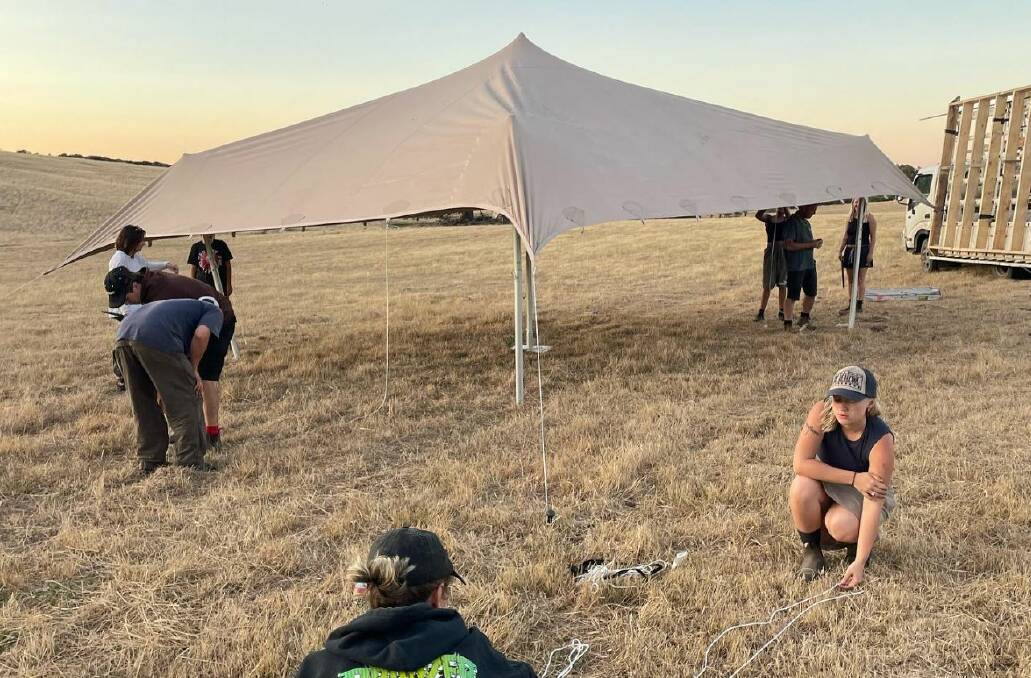 Organisers during set-up in paddocks at the Tuki Trout Farm paddock last Saturday. The 2 Degrees festival was due to be held from February 23-26 but its cancellation was announced on Tuesday. Picture via Facebook.