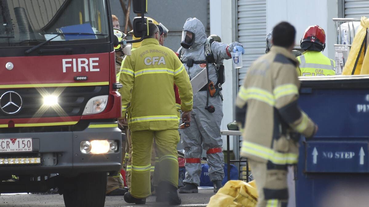 TOXIC SPILL: Firefighters in action at the scene of Friday's mercury mishap. Picture: Lachlan Bence.