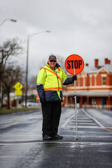 SAFETY: Ray Bykersma is employed by the City of Ballarat to keep a close eye on traffic in Mair Street for Pleasant Street Primary. Picture: Luke Hemer. 