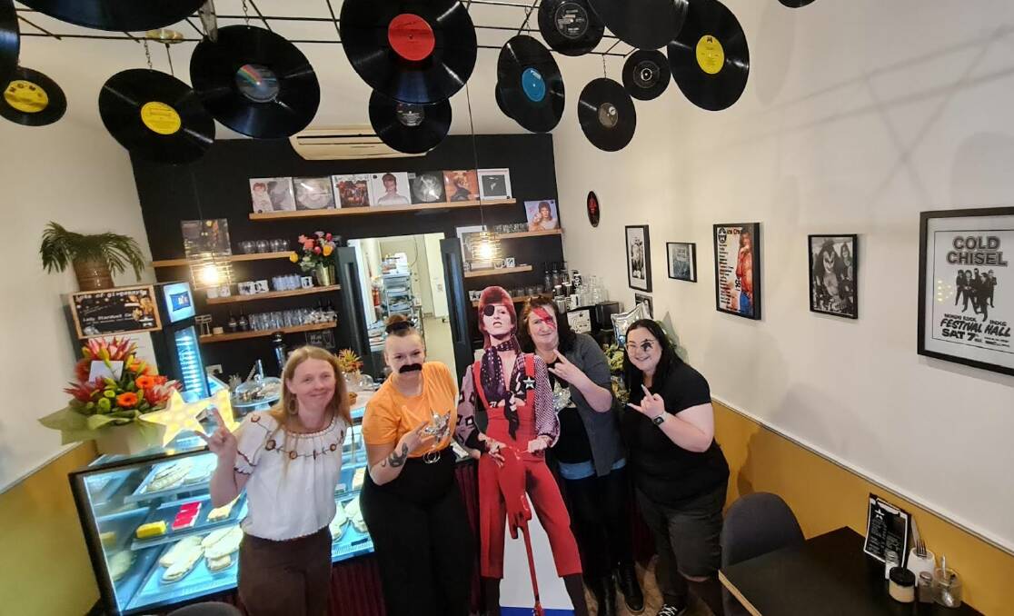 Lady Stardust owner Jo Britt with 'David Bowie' staff (L-R) Hayley, Lexi and Raigan. Picture by Gabrielle Hodson.