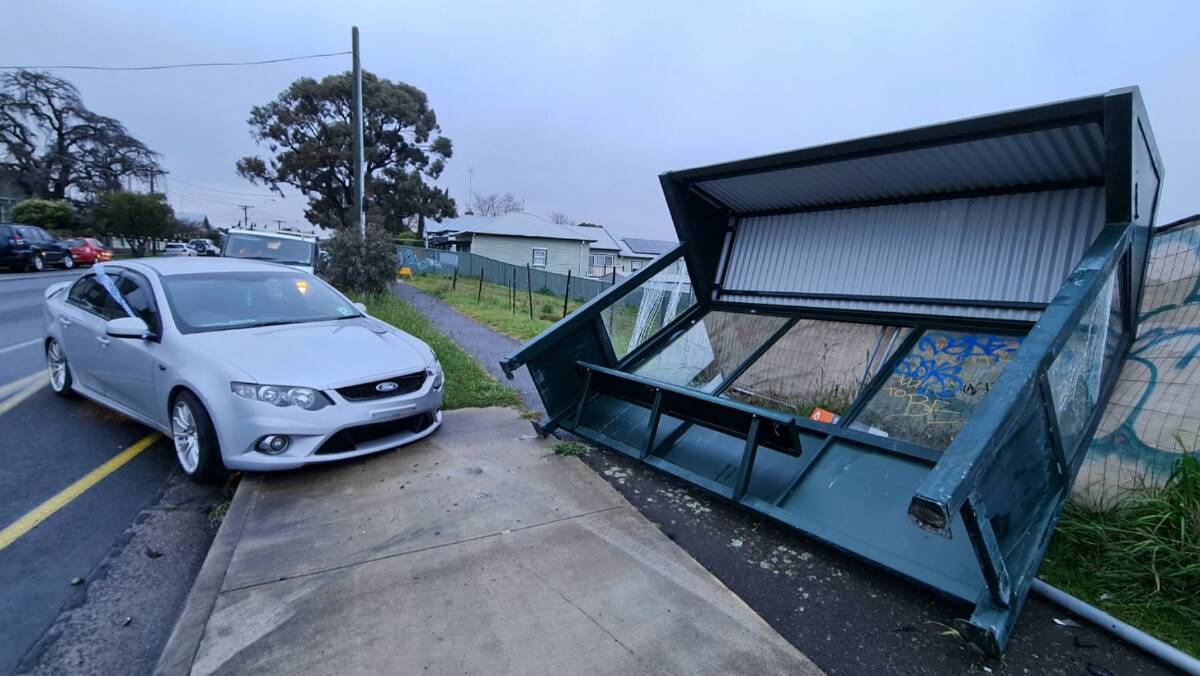 The impact has pushed a bus shelter into a precarious position. Picture by Gabrielle Hodson.