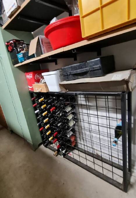 A once-full wine rack has been emptied of dozens of bottles in the Stewarts' Buninyong garage. Picture by Gabrielle Hodson