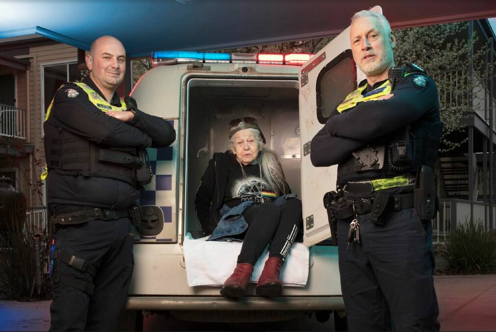 Irene Hannah is going home in the back of a divvy van - thanks to grinning Trentham Senior Constable Jason Allison and Daylesford Senior Constable Jeremy Freckleton. Picture by David White.