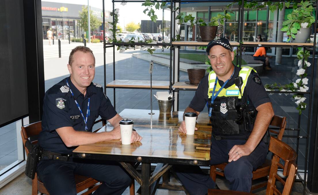 Ballarat Senior Sergeant Brett Van Der Vliet and Acting Senior Sergeant David Whitwell
brew up some business ahead of Wednesday's Coffee with a Cop at DTC. Picture by Kate Healy. 
