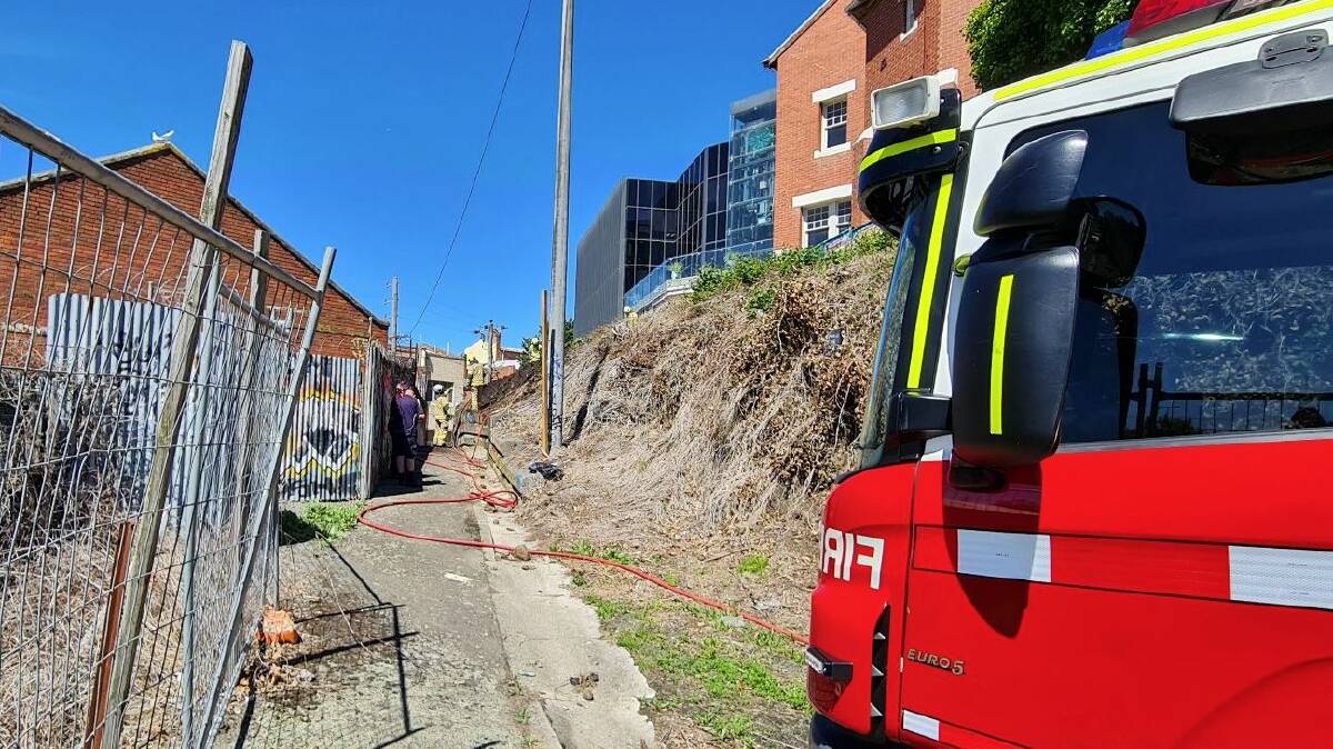 The City of Ballarat has removed dead overgrown vegetation on a steep slope behind offices in Camp Street after a Ballarat CBD grassfire on Wednesday. Picture by The Courier.