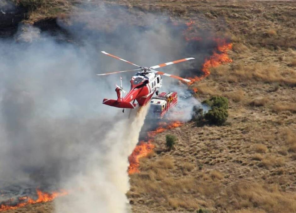 Water bombing helicopters were among 47 appliances that were called to the isolated valley, east of Ballan at the weekend. Picture by Wayne Rigg.