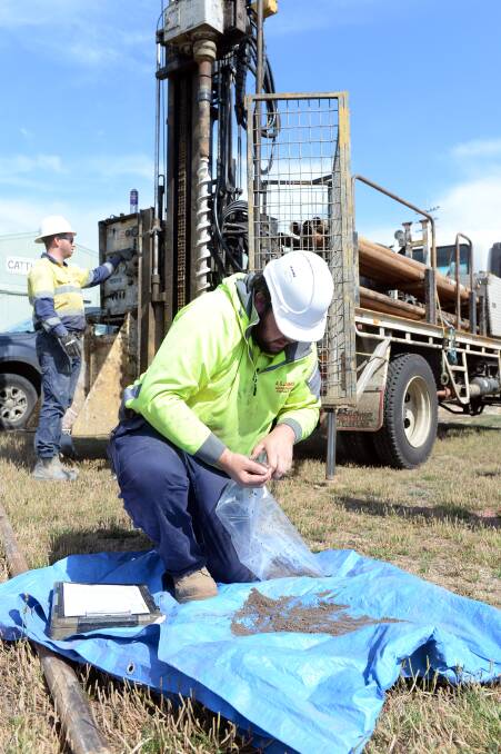 Ballarat based geotechnical experts Wade Fullerton and Nicholas Wetemans sort out siltstone samples, ready to be sifted by archeaologists for indigenous and other artefacts beside Eureka Stadium. Picture by Kate Healy.