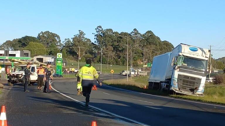 A B-double ended up in a ditch in a Western Highway median strip about 6.30am on Wednesday. An hour later, three vehicles collided near the Mill Markets. Picture by Leonora Duffy.