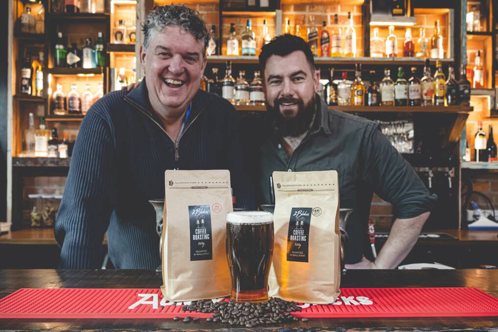 Marc Amos from 2 Blokes Coffee Roasting (left) and Matt Ives from Aunty Jacks Brewery with the Long Black Lager they created together. Picture supplied