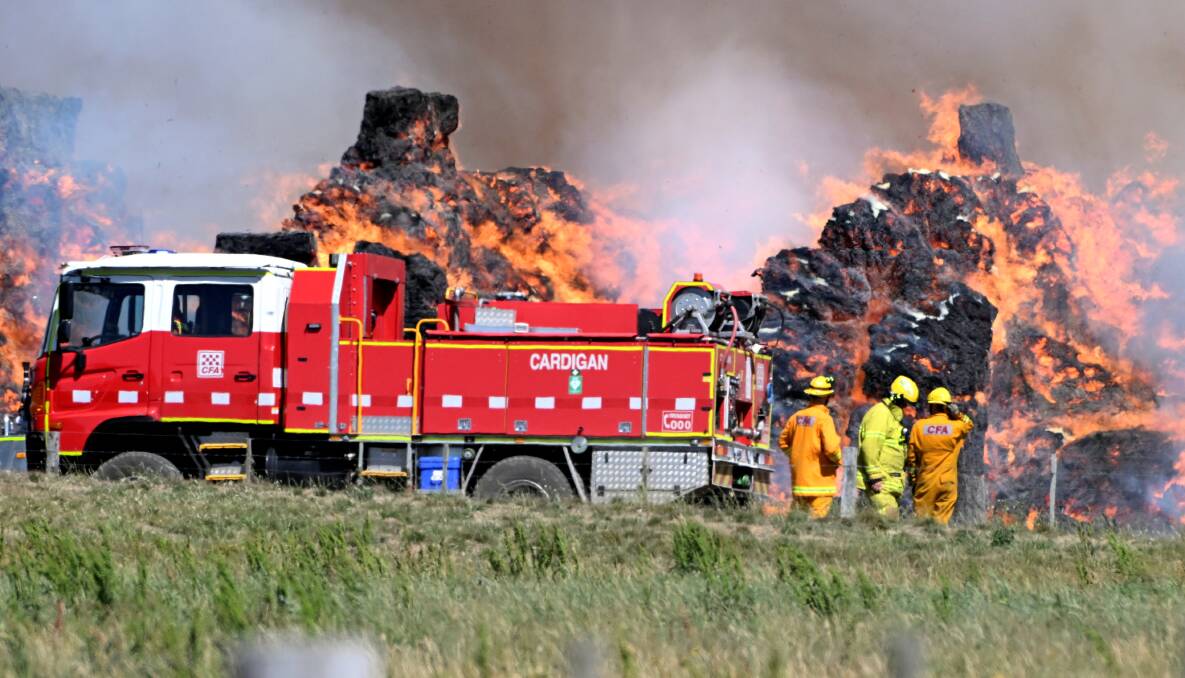 Emergency services fight to contain flames at a farm in Burrumbeet. Picture by Lachlan Bence