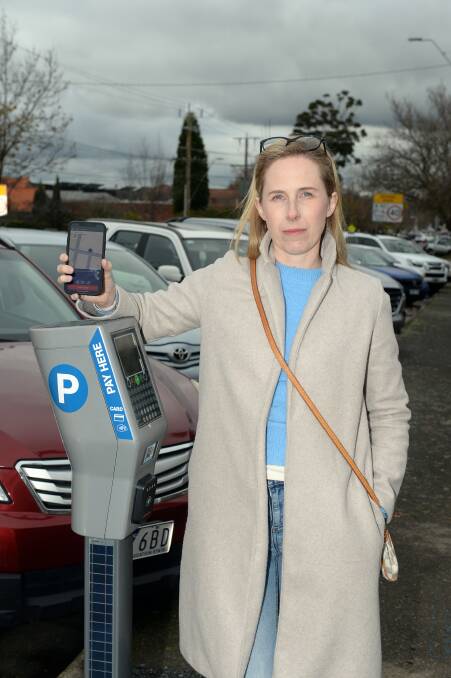 Caitlin Honeyman standing next to a parking meter on Mair street. Picture by Kate Healy