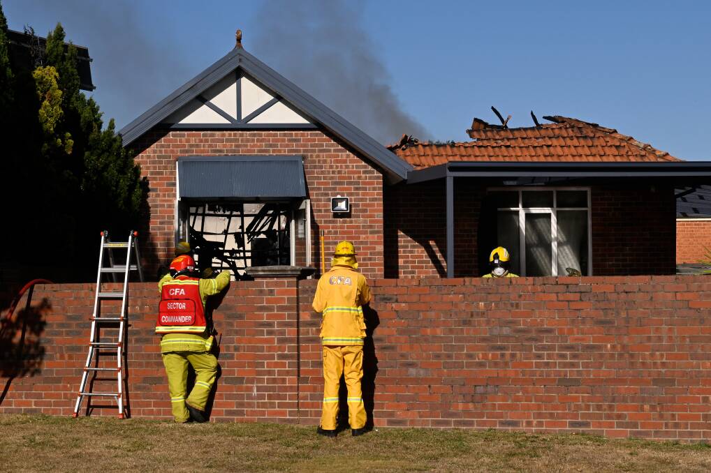 Firefighters survey the damage to an Alfredton home on February 10, 2024. Picture by Adam Trafford