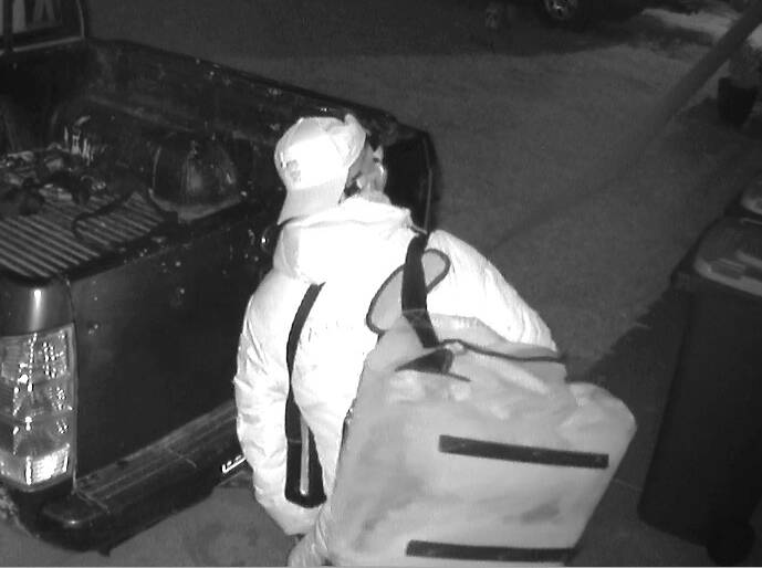 The man was captured wearing a cap, mask and carrying a large bag. Picture supplied