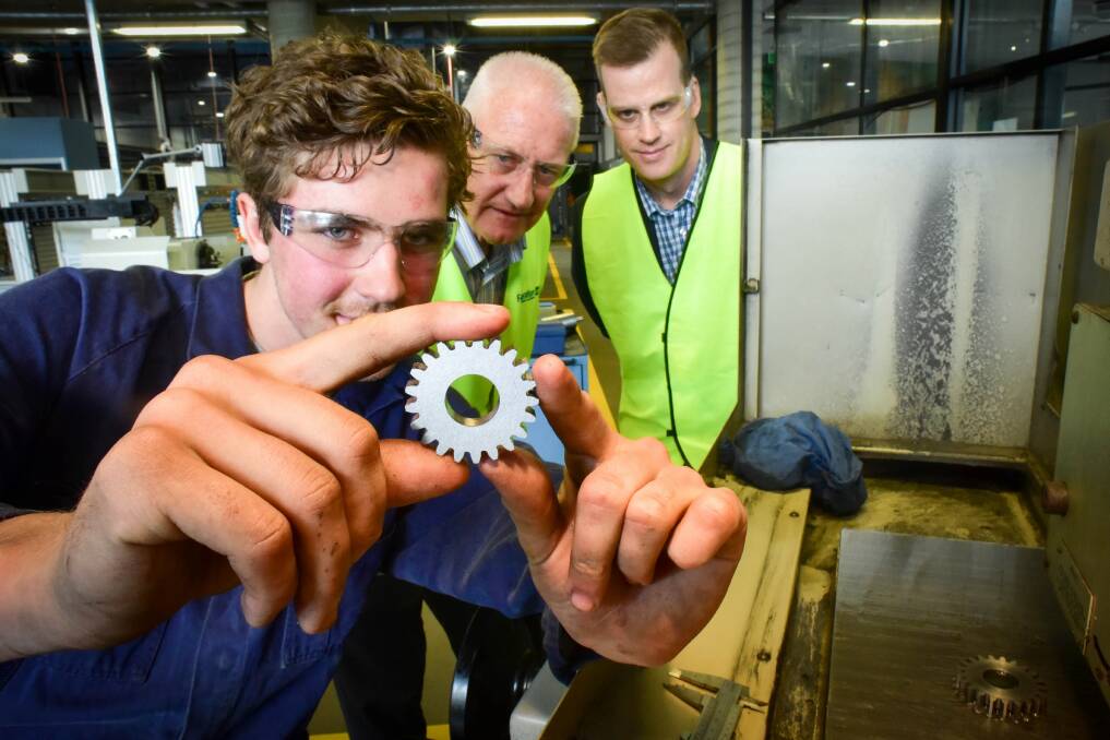 Apprentice Myles Keith, Federation TAFE executive director Associate Professor Barry Wright and Tilt Renewables general manager of renewable development Clayton Delmarter at the launch of a new scholarship program in 2019. Picture: Brendan McCarthy