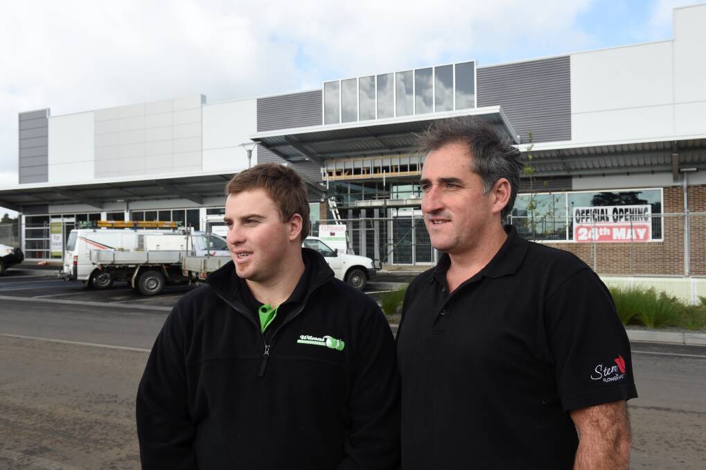 Peter Wilson of Wilson's Fruit and Vegetables and Richard McClure of Stems Flower Market ahead of their Lucas store openings in 2014. Picture by Lachlan Bence
