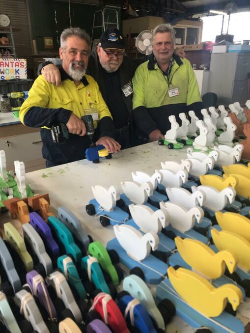 Ballarat East Mens Shed members Alan Crittenden, Alan Buchanan and Ron Vervaart with wooden toys ready to be sent to children in wartorn Syria. Picture supplied